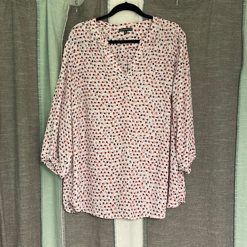 Brightly colored puff sleeve blouse